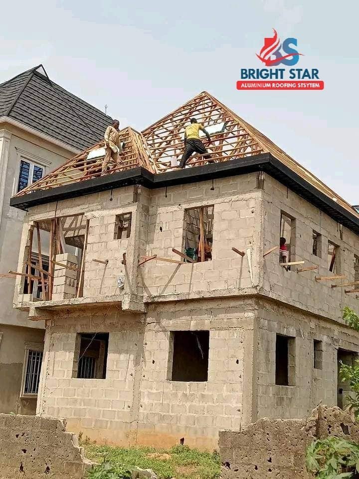 Roofers installing a new roof on a duplex